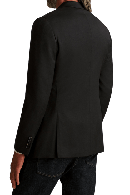 Costume en laine extensible noire à revers crantés et 2 boutons 