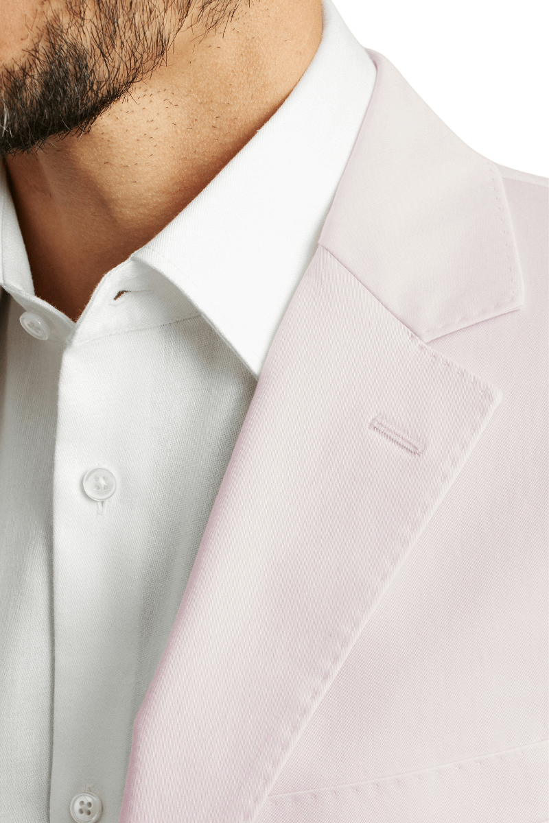 Traje italiano rosa de corte moderno con botonadura sencilla y dos botones