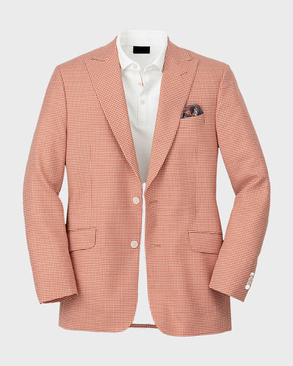 Chaqueta de lana con solapa de pico y botonadura sencilla en pata de gallo en color naranja y blanco